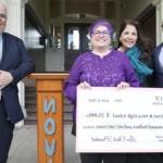 NOVA Principal, SPS Superintendent, Alliance for Education Leader and Dr. Mercer smile at camera with big check.